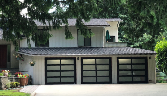 Modern garage doors designed for sleek exteriors by Garage Tech serving Kenmore, WA