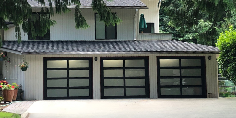 Contemporary garage doors with glass panels by Garage Tech serving Redmond, WA