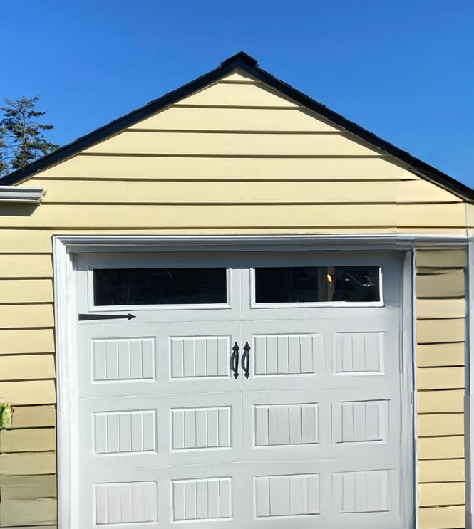 Wood carriage garage doors with familiar traditional styling by Garage Tech serving Kenmore, WA