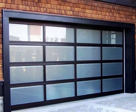 Natural wood carriage style garage doors installed by Garage Tech for Kenmore, WA area homes