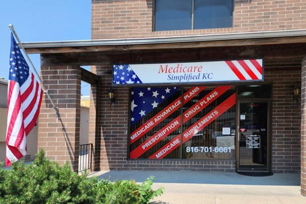 A group of business people are posing for a picture together