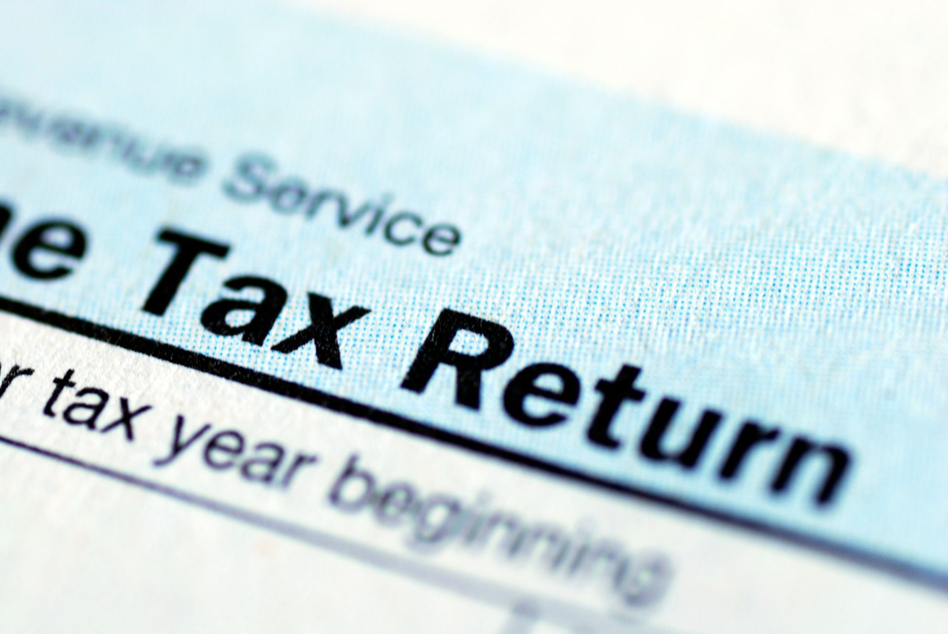 Close-up of a light blue tax form with the words 