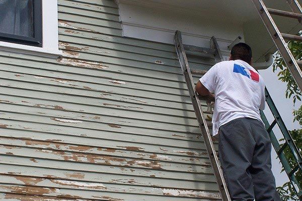 Man Painting a Wall — Interior and Exterior Painting Service in Clackamas, OR