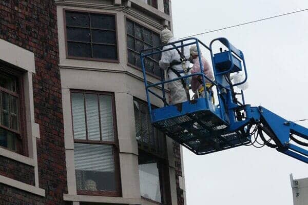 Two man standing on the Lift — Interior and Exterior Painting Service in Clackamas, OR