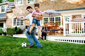 Father Playing Soccer with Daughter — Home Owners Insurance in Cambridge, MD
