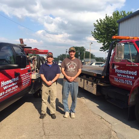 Man Fixing a Towed Car — Junction City, KS — Homestead Tow Service