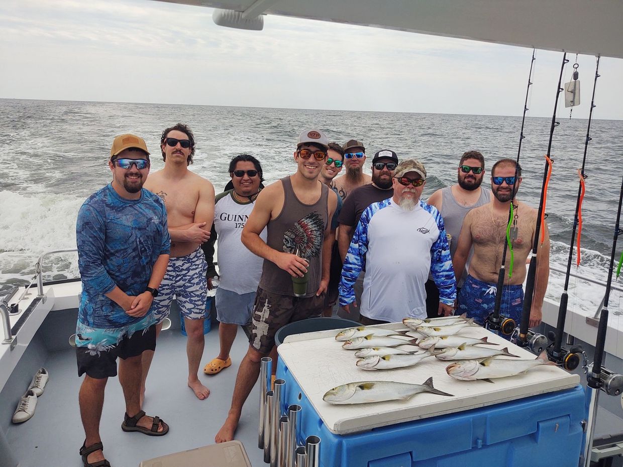 A group of men are standing on a boat on the Chesapeake Bay.