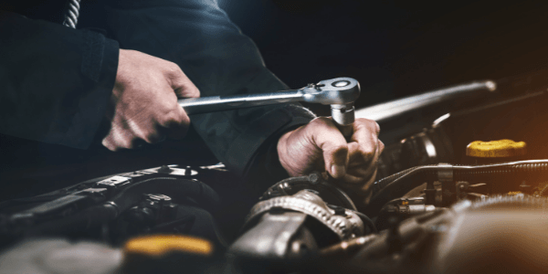 The hands of a mechanic performing a Car Service in Hastings