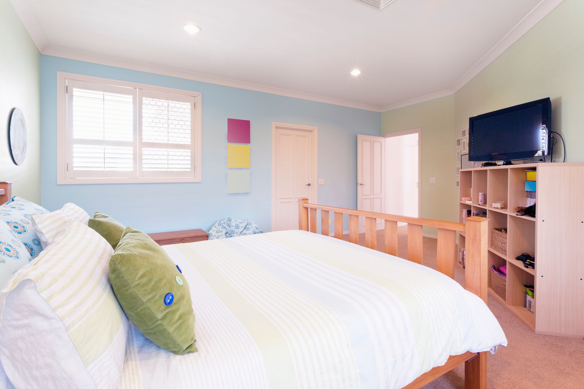 An aerial view of a small town next to a river.