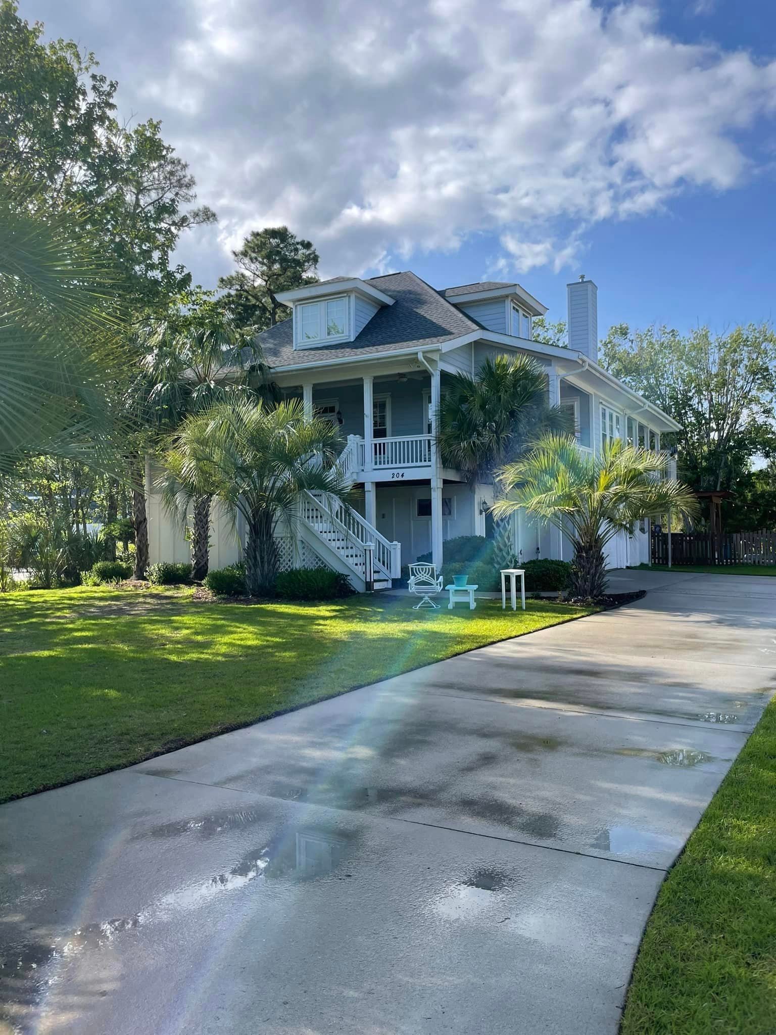 A Courtyard In Front Of A Building — Leland, NC — Coastal Exterior Solutions