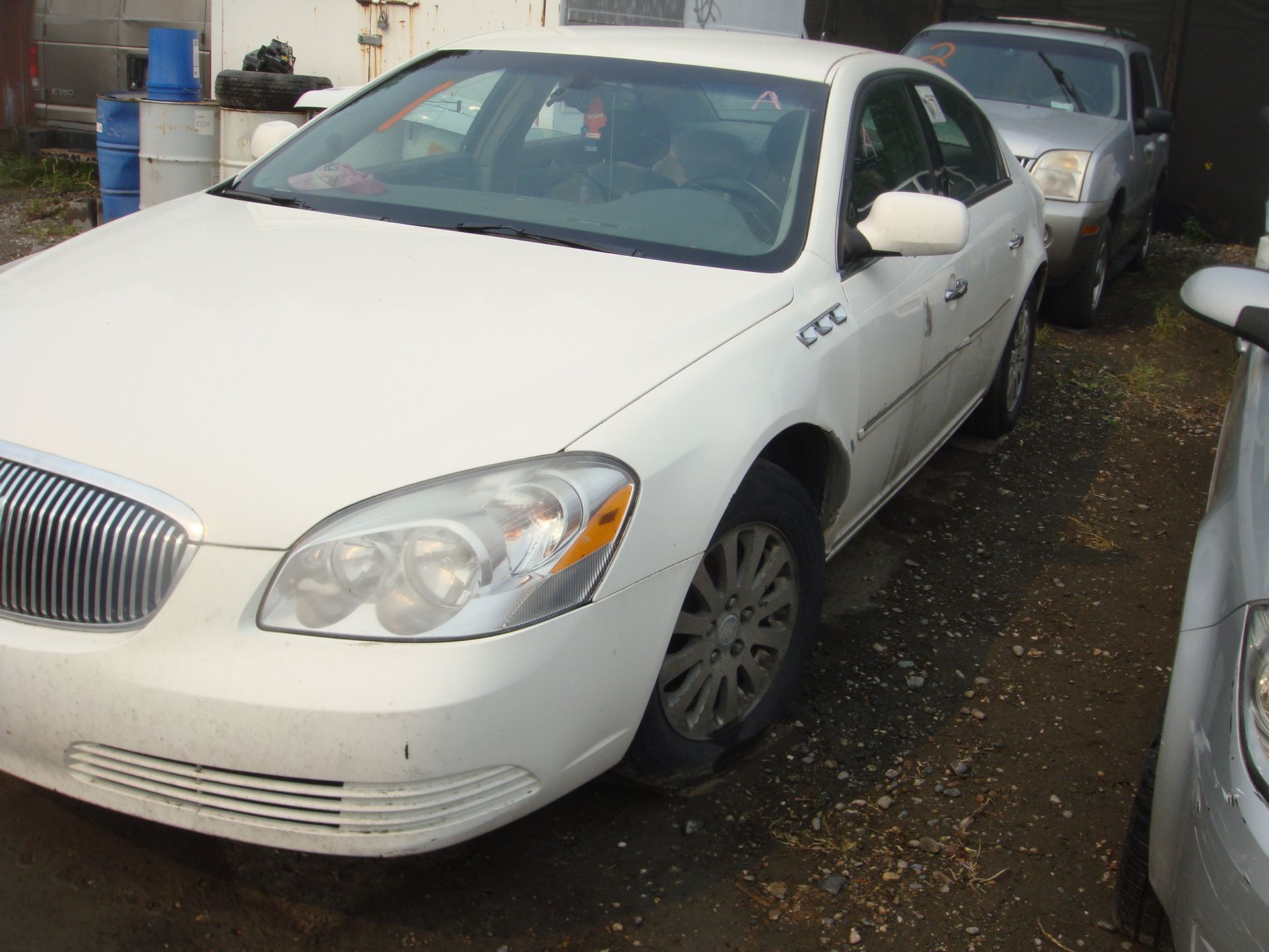 A white car with the word cdc on the side