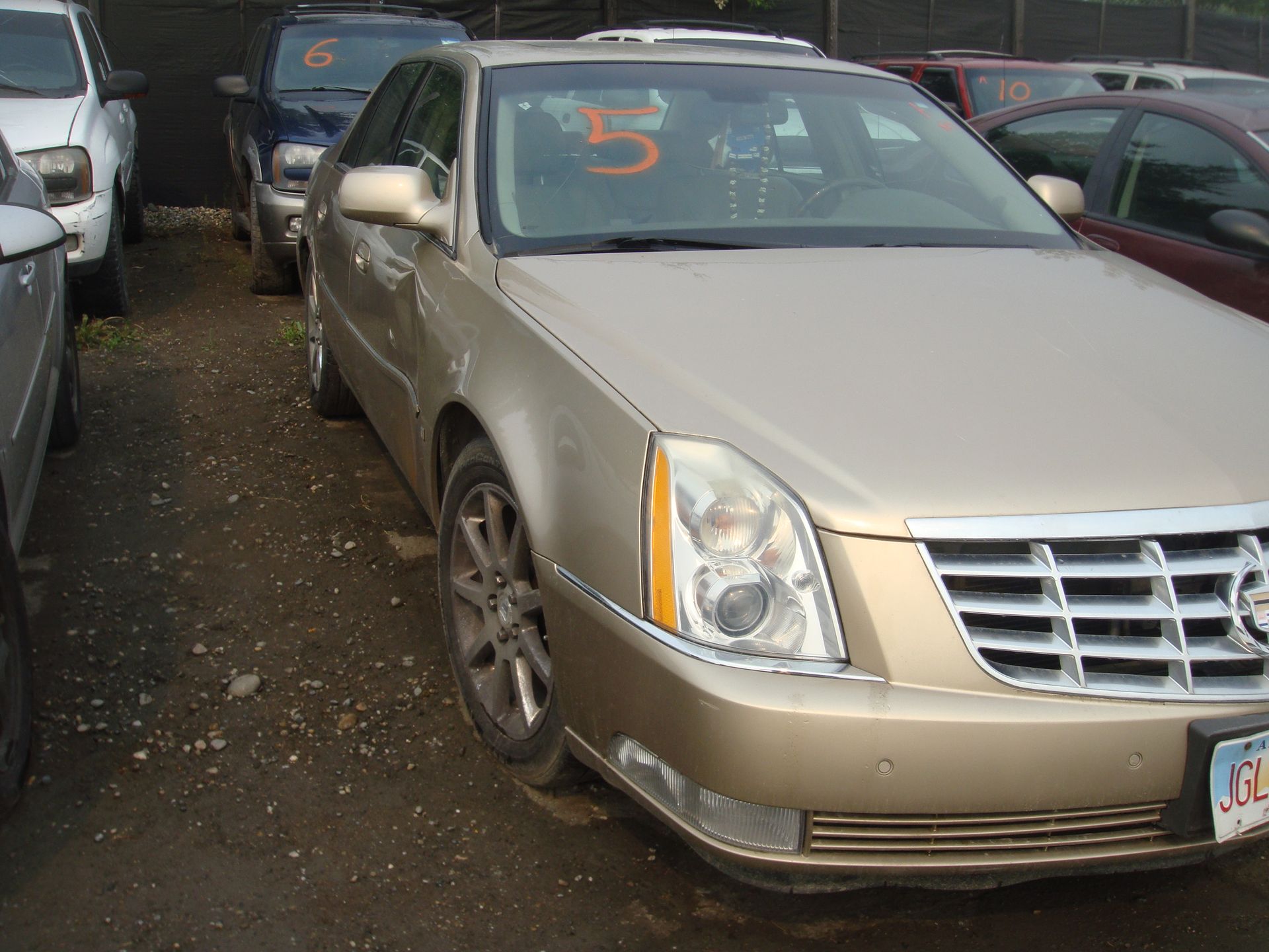 A car with the number 5 on the windshield