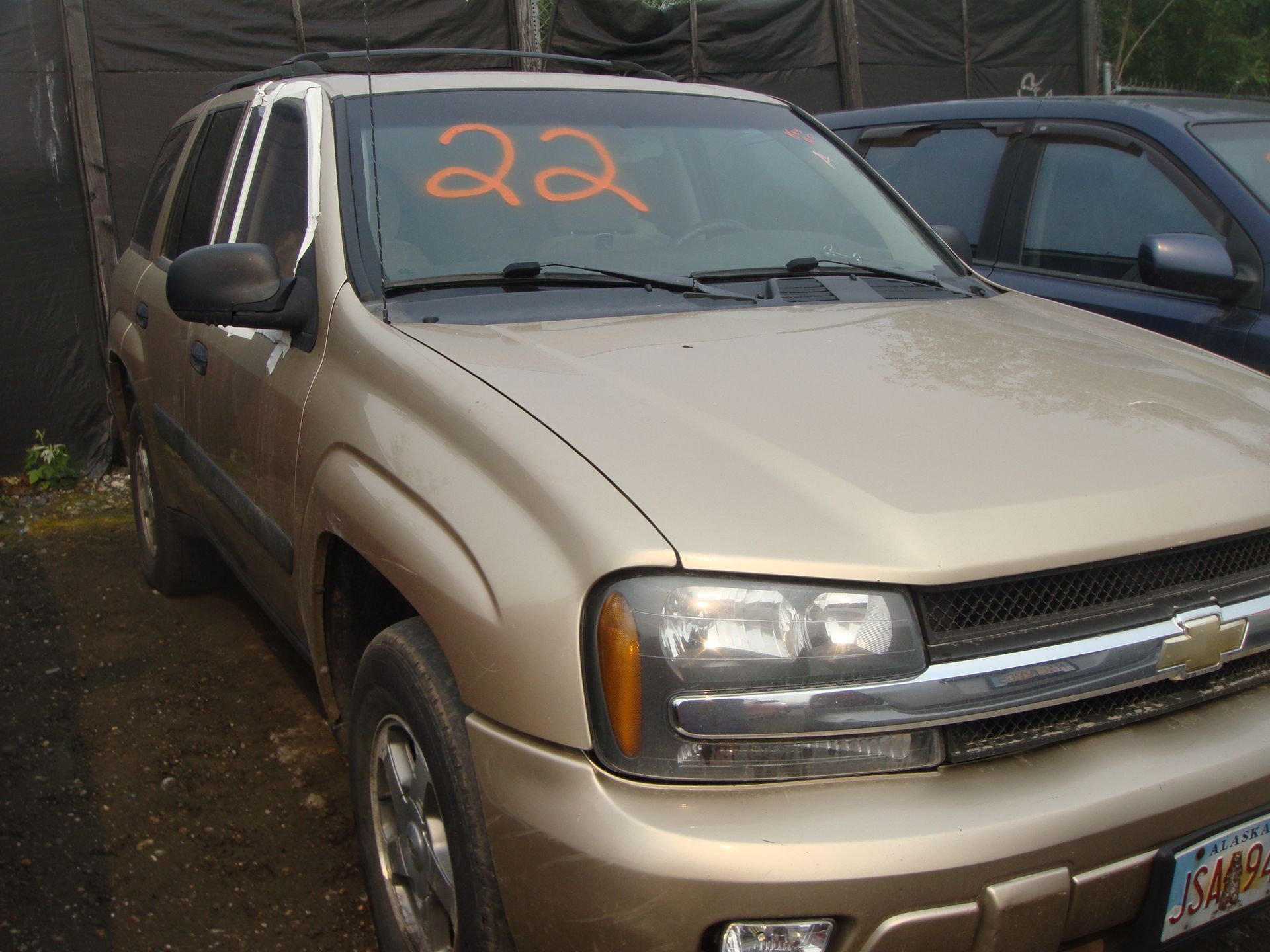 A car with the number 22 on the windshield