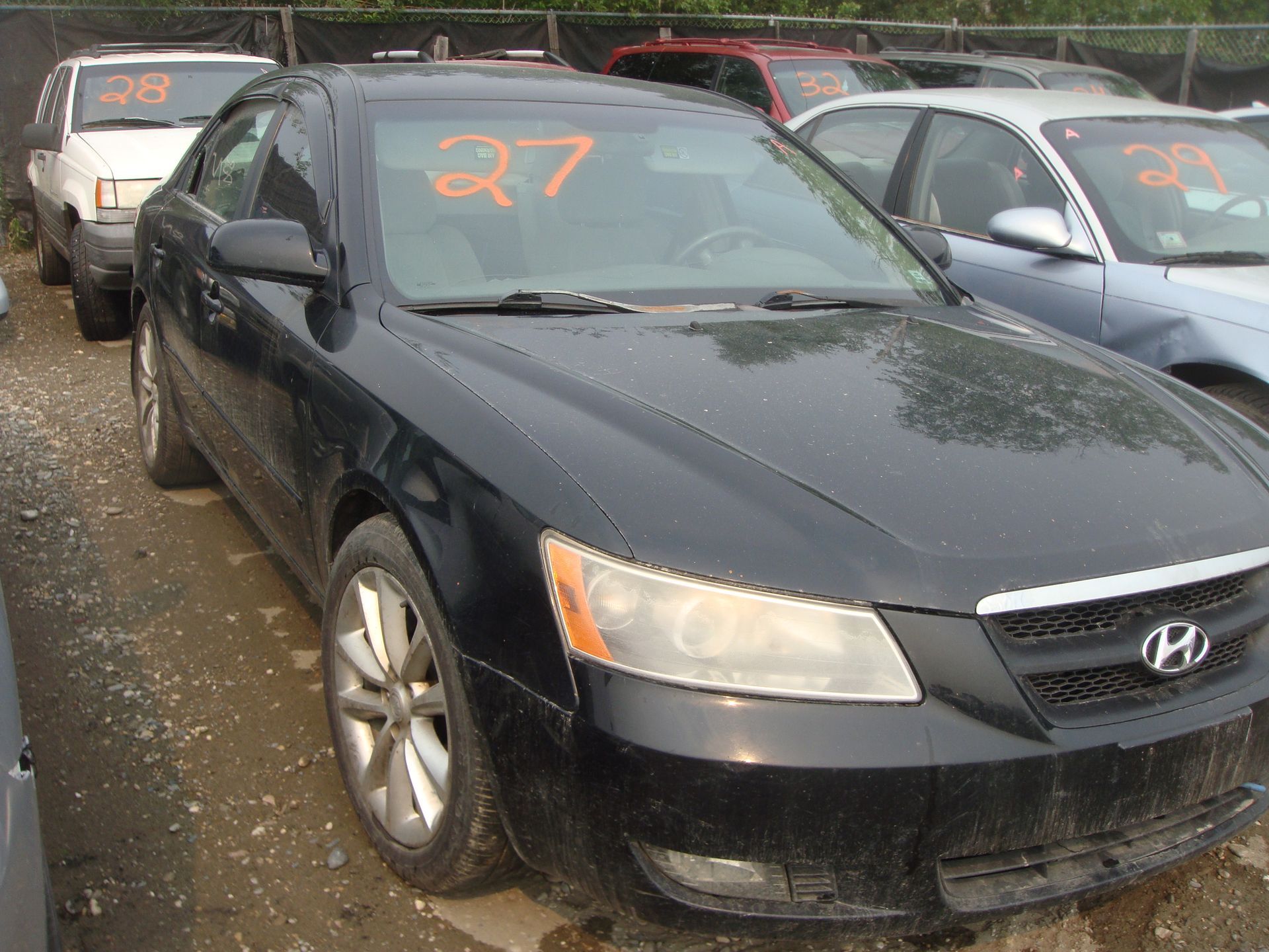 A black car with the number 27 on it