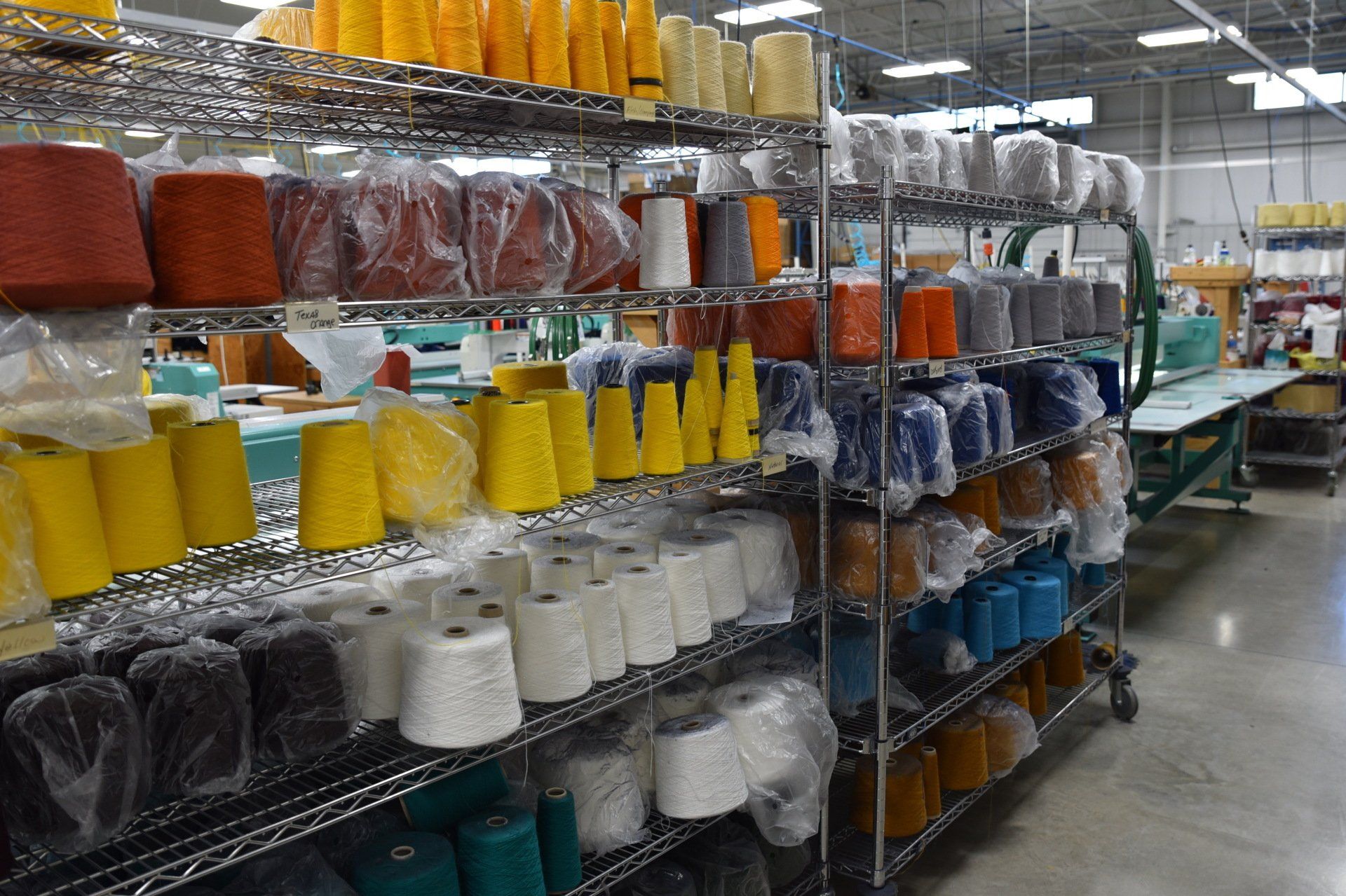 Various spools of fabrics for sewing.