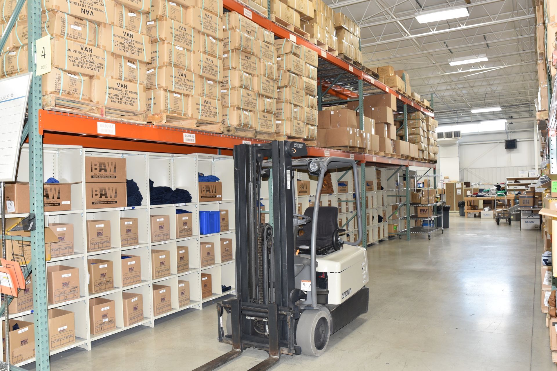 Forklift moving through warehouse.