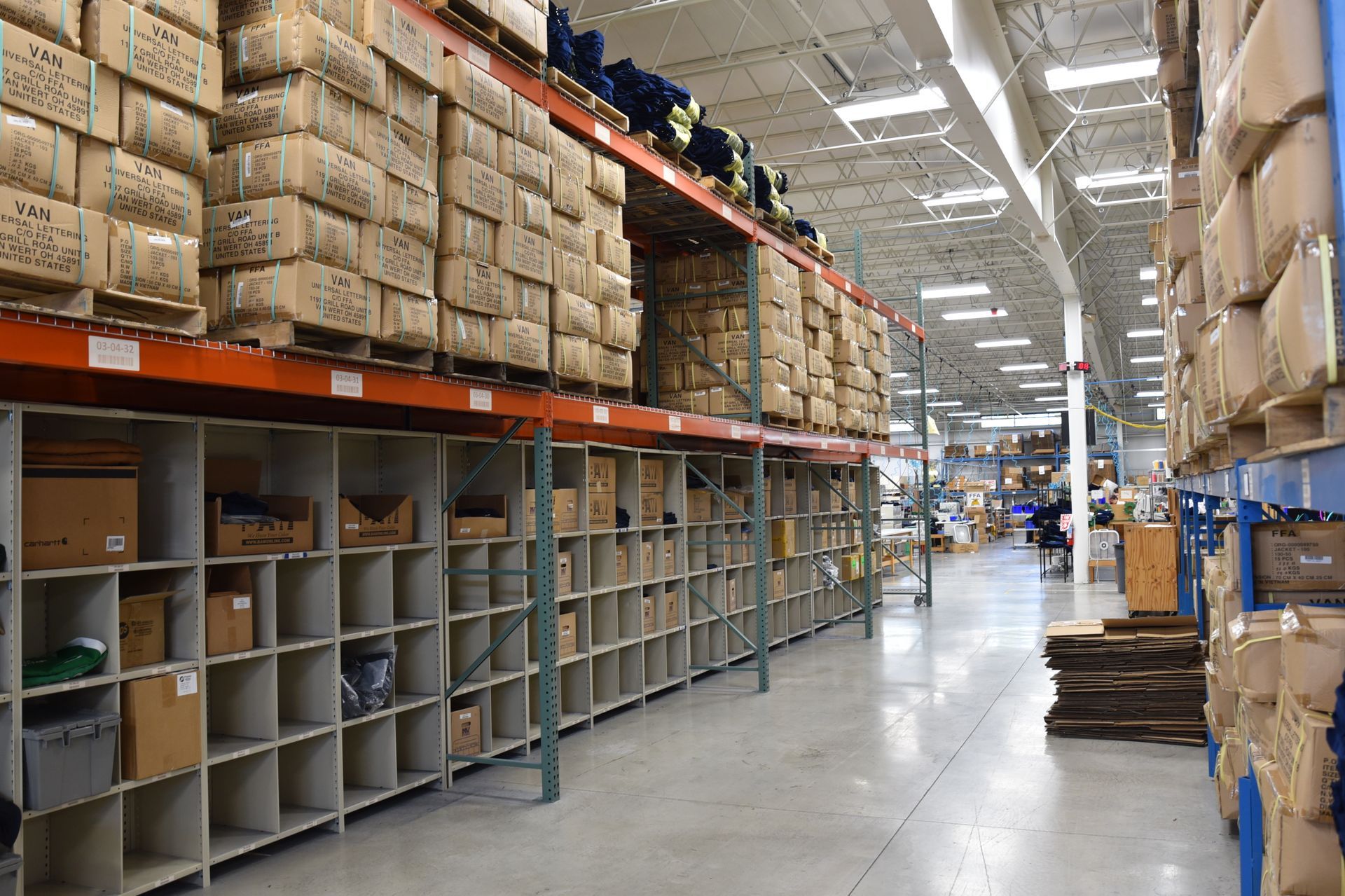 Selves in a warehouse with palettes on 