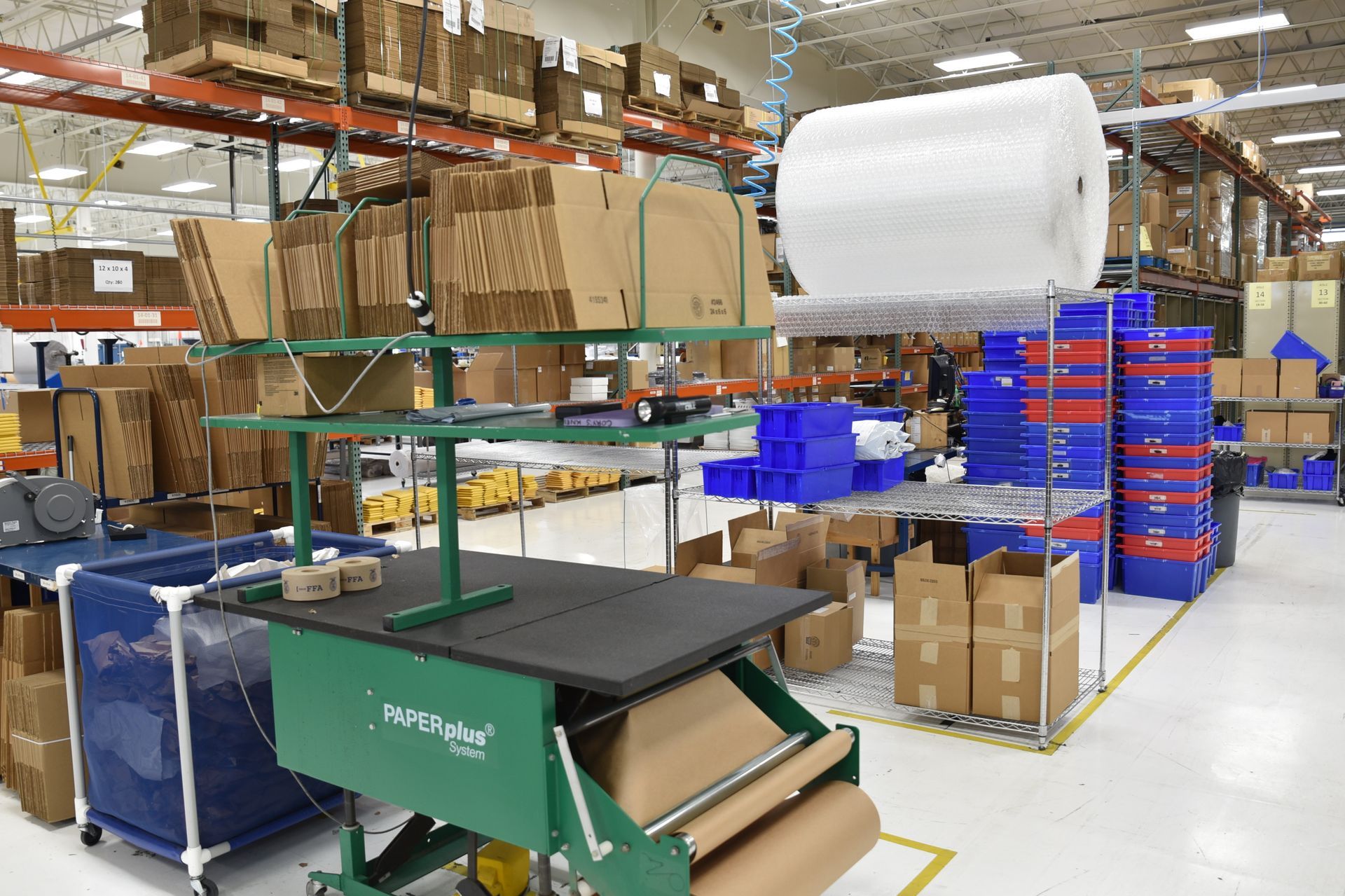 Cardboard processing line for packaging.