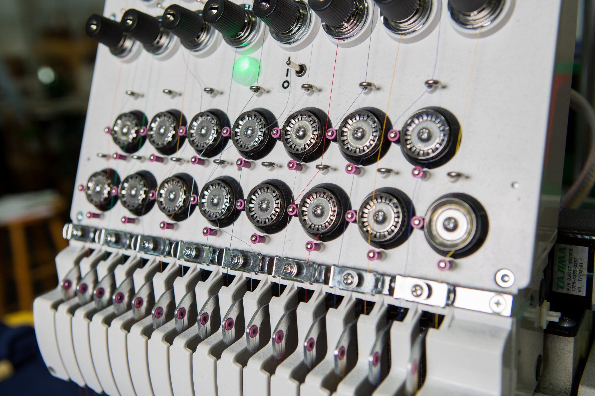 Dials for adjusting the sewing machine.