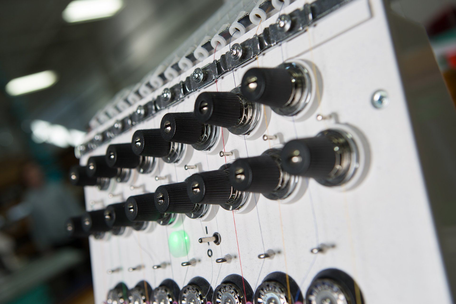 Dials for adjusting the sewing machine.
