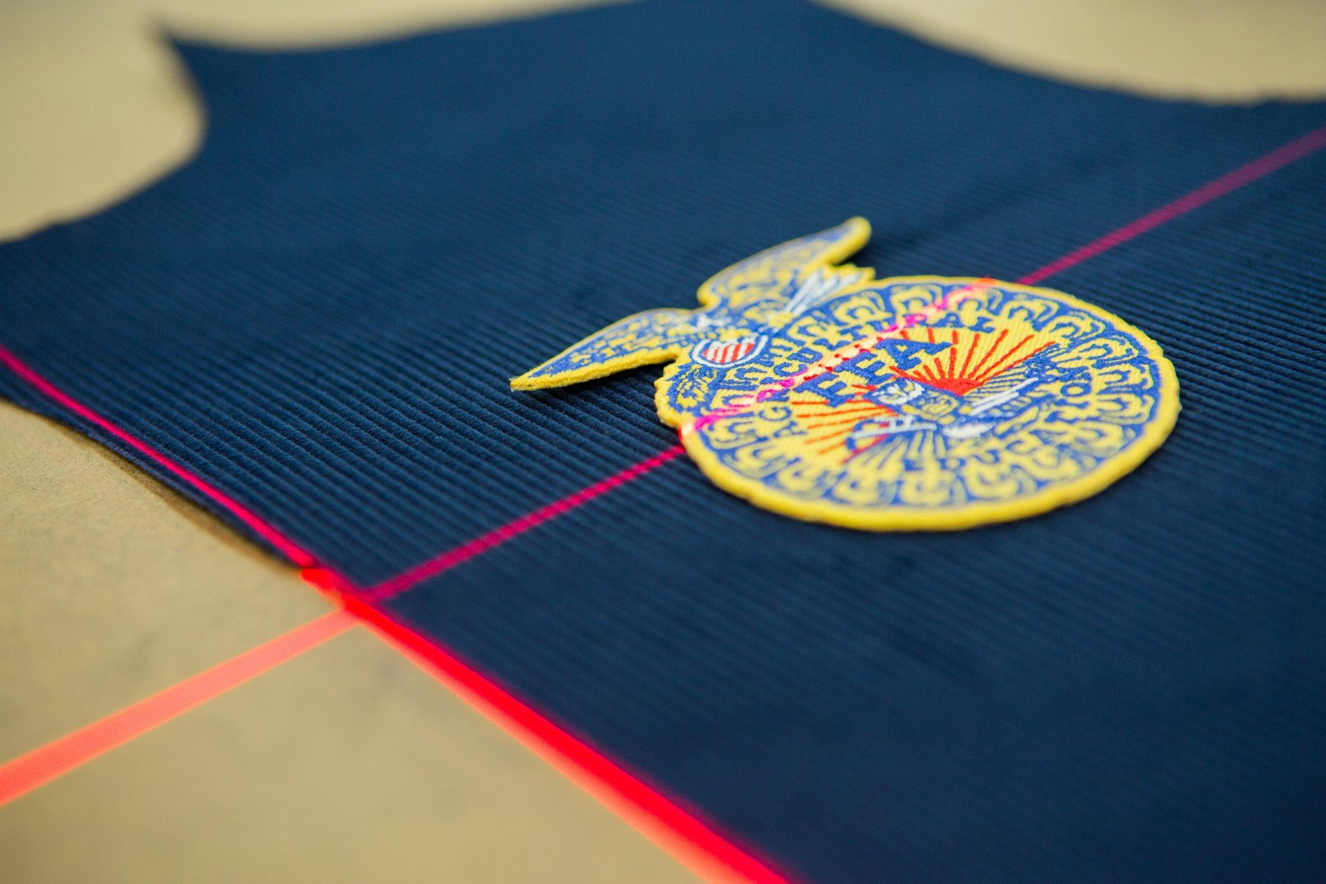 An FFA Jacket being measured out with laser lines.