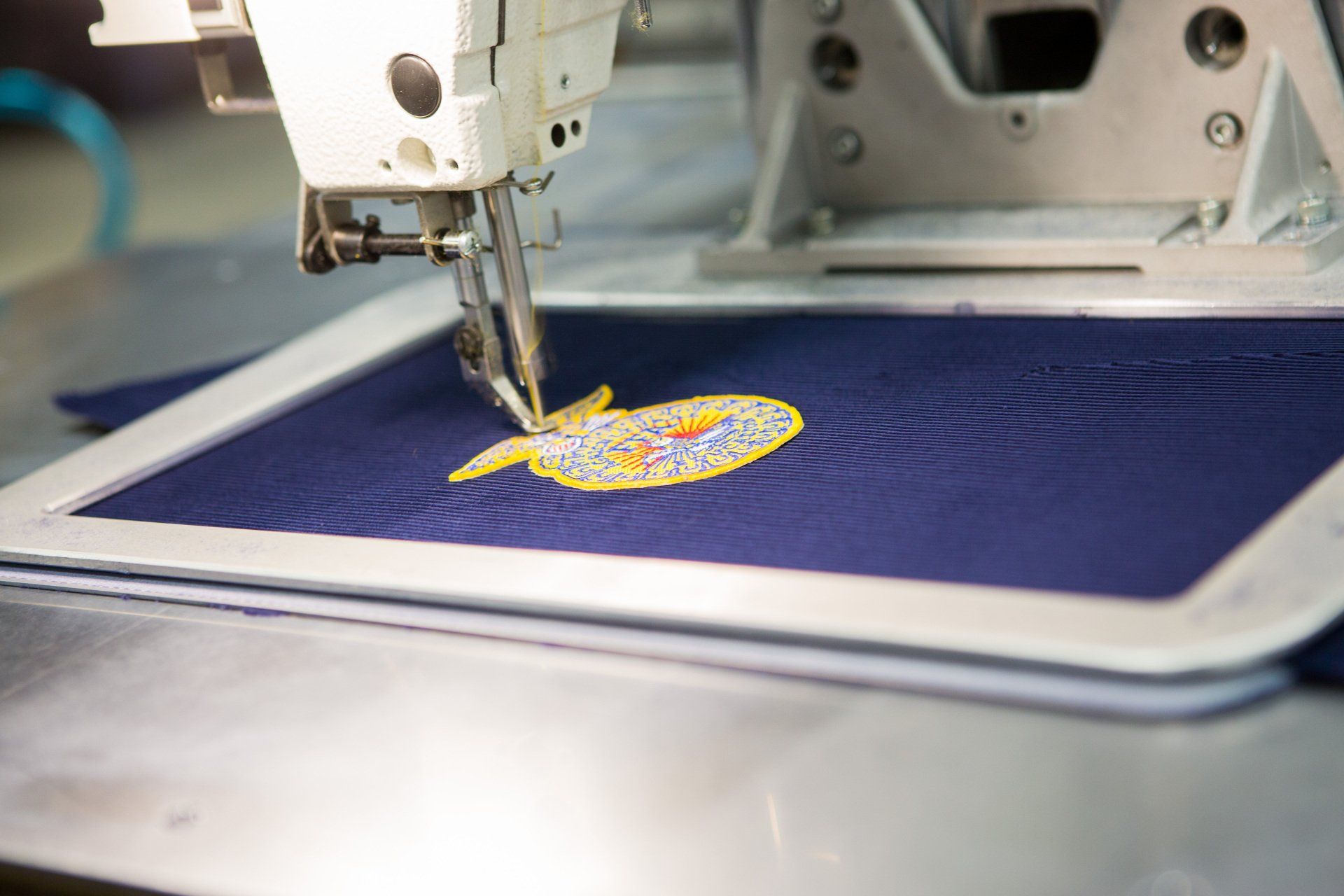 An FFA patch being sewed into a jacket.