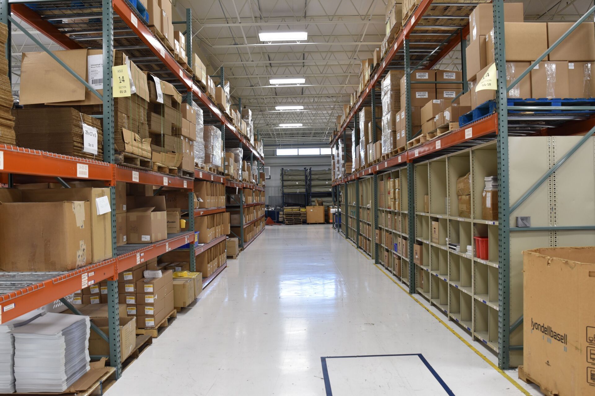 A warehouse filled with boxes of fabric.