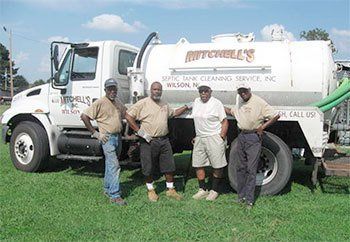 Mitchell's Cleaning Team Standing in Front of Truck