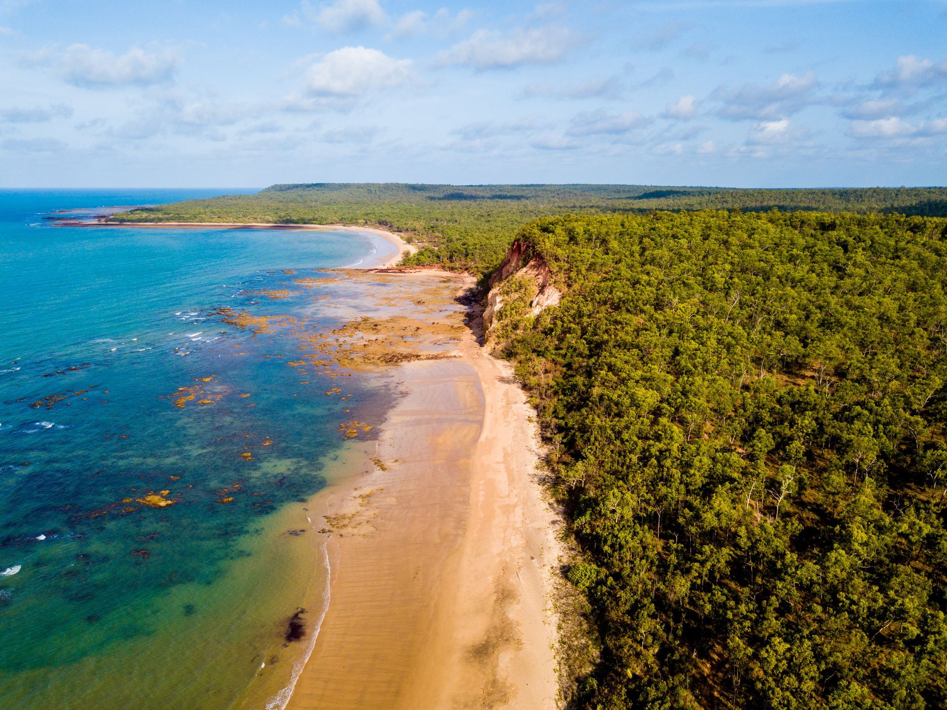 Sandy Beach Meets Turquoise Ocean — Wendy's Safety Services in Nhulunbuy, NT