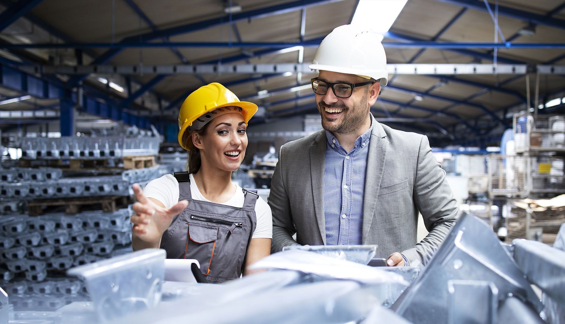 Factory Worker And Manager In Hard Hats Discussing Plans — Wendy's Safety Services in Katherine, NT