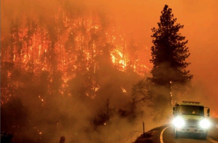 Red first aid kit open with pills, bandages, and supplies spilling out.