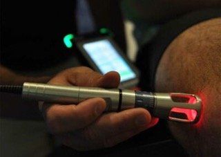 Close up of acupuncture needles in foot