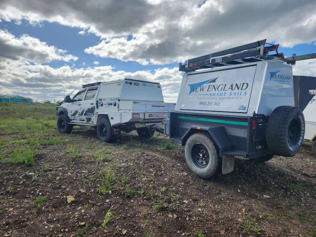A Truck with A Trailer Attached to It Is Parked in A Field — New England Shade Sails in Tamworth, NSW
