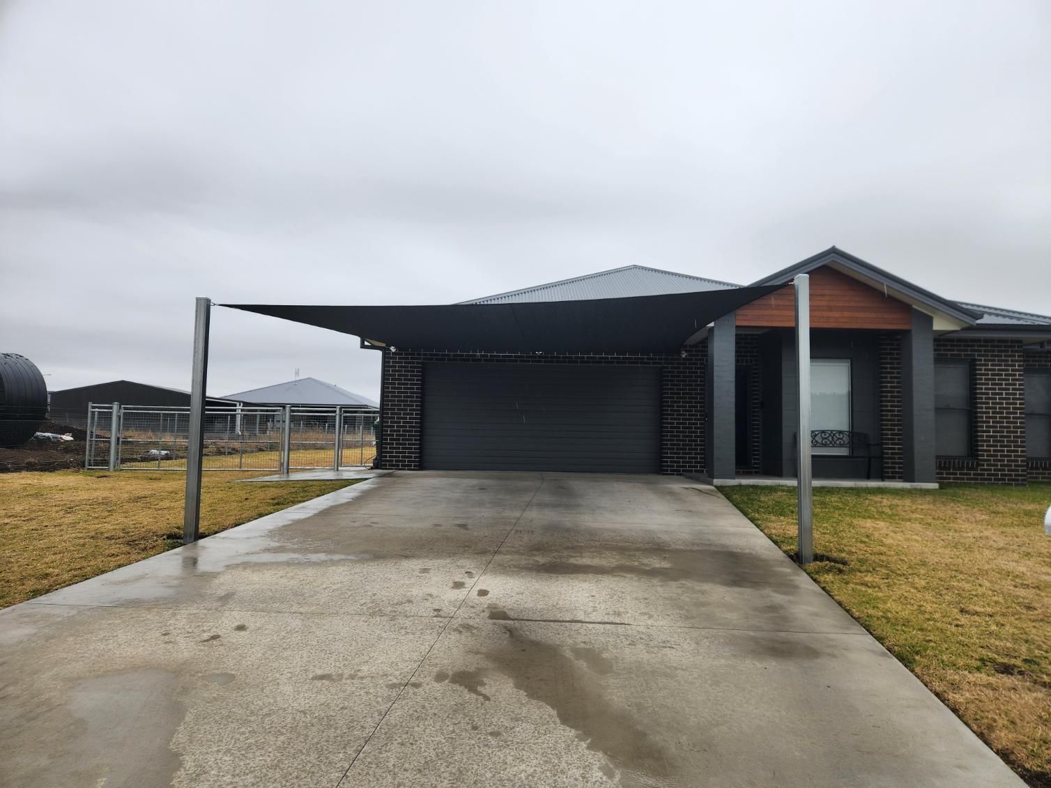 A House with A Carport and A Concrete Driveway — New England Shade Sails in Armidale, NSW