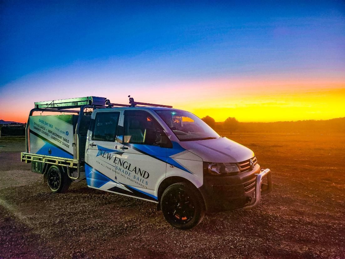A Van Is Parked in A Field at Sunset — New England Shade Sails in North Tamworth, NSW