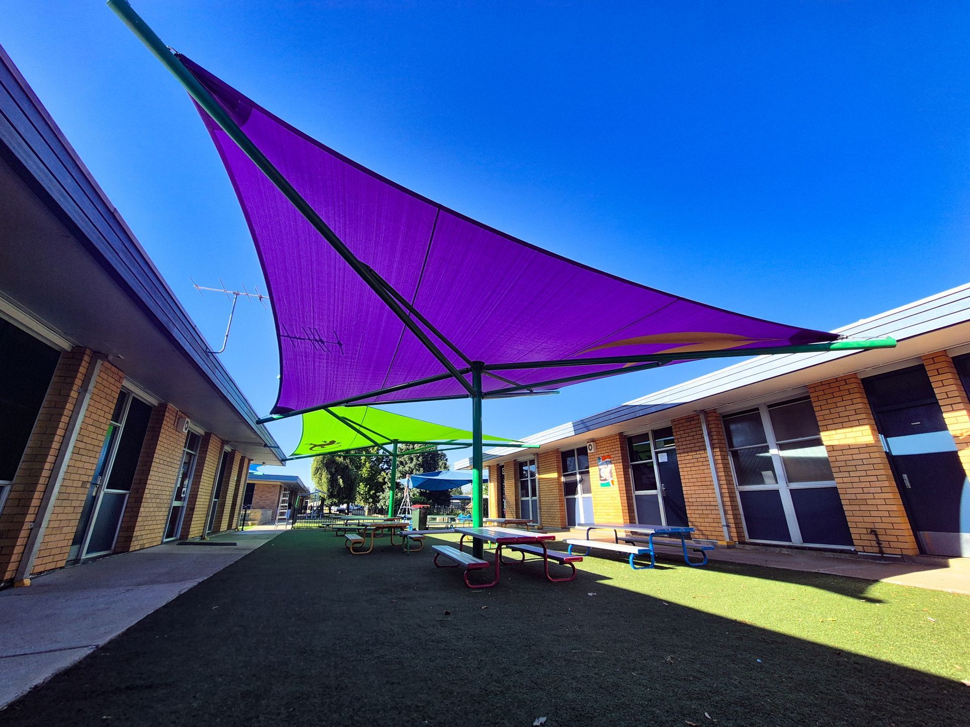 A Hot Tub Is Covered by A Shade Sail in The Backyard of A House — New England Shade Sails in North Tamworth, NSW