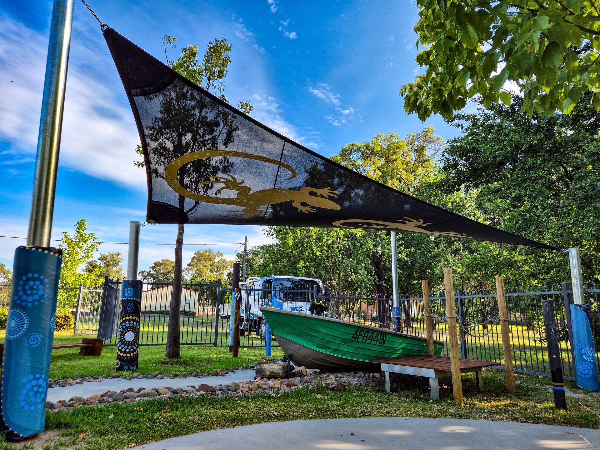 A Large Black Umbrella Is Sitting in The Middle of A Grassy Field — New England Shade Sails in North Tamworth, NSW