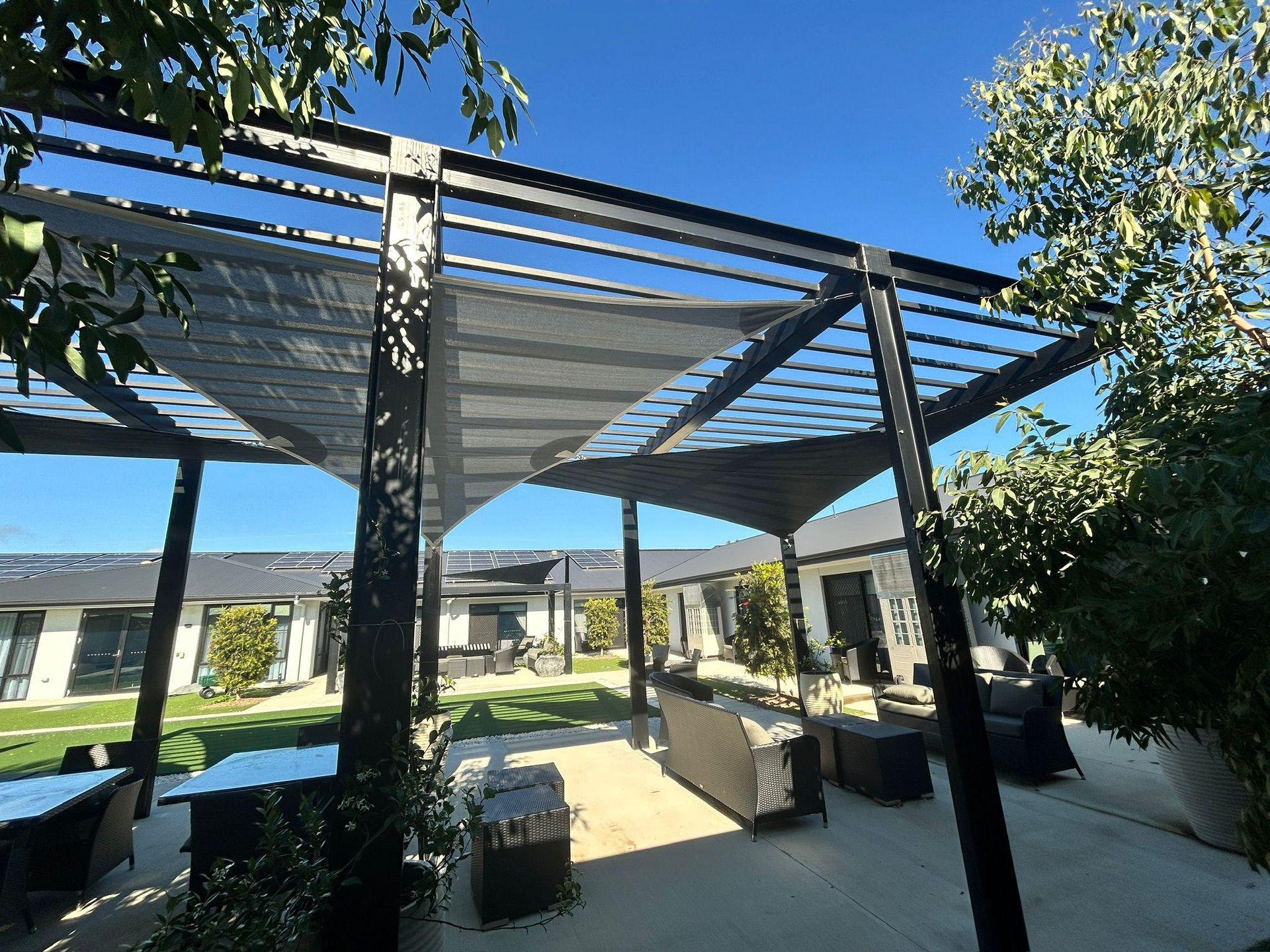 A Tent Is Sitting in The Middle of A Grassy Field — New England Shade Sails in North Tamworth, NSW