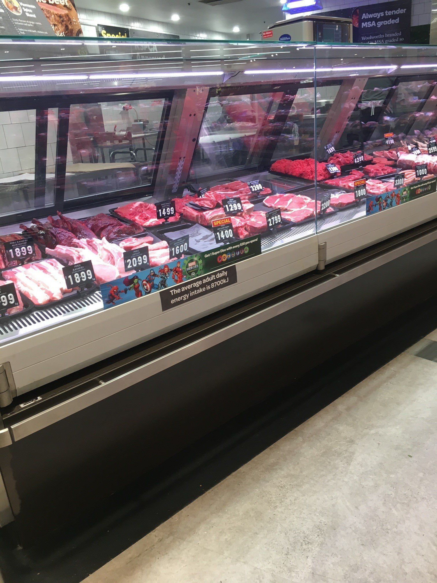 a butcher 's display case filled with meat