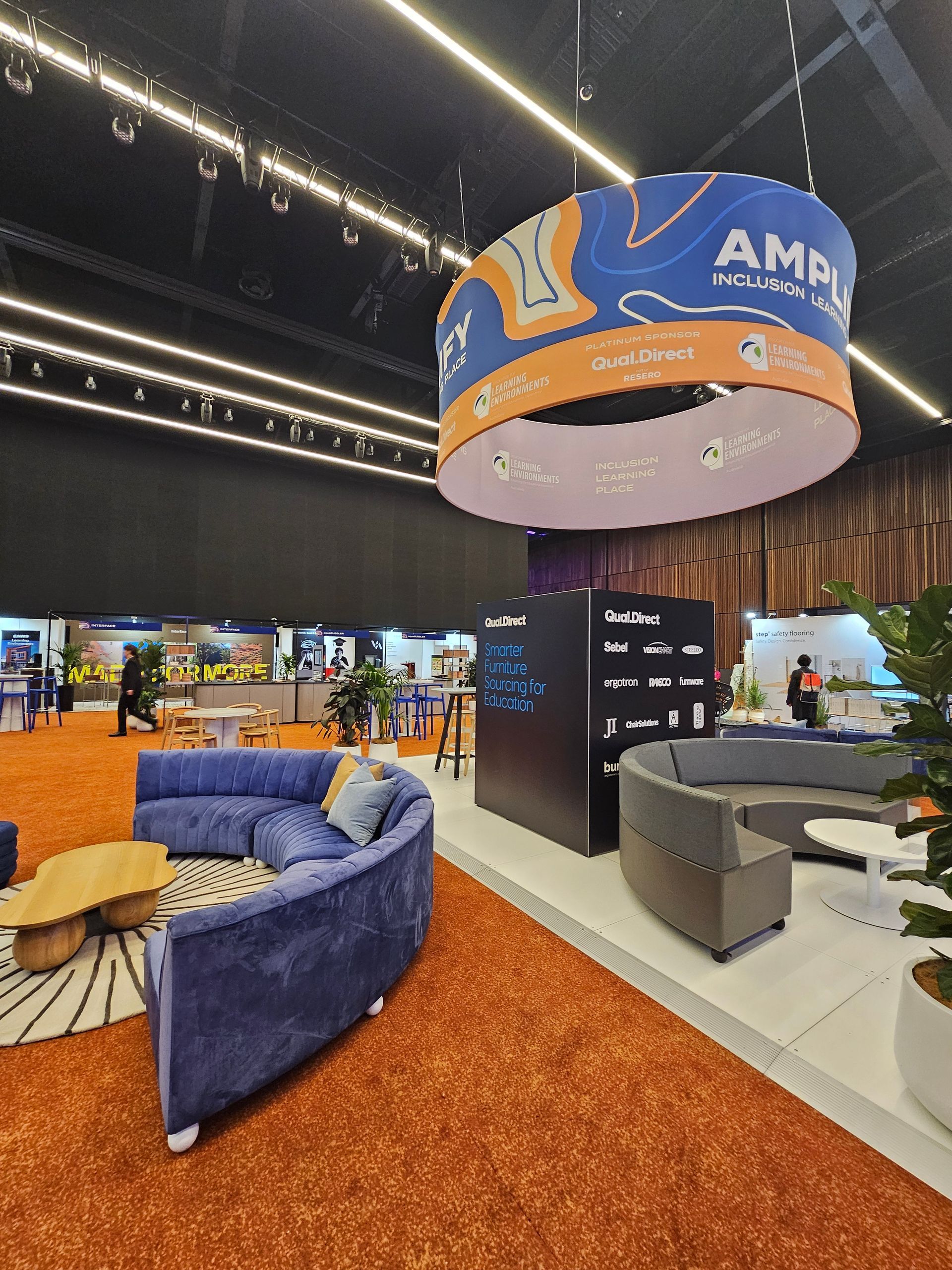 A room with a couch and a sign that says amp on it