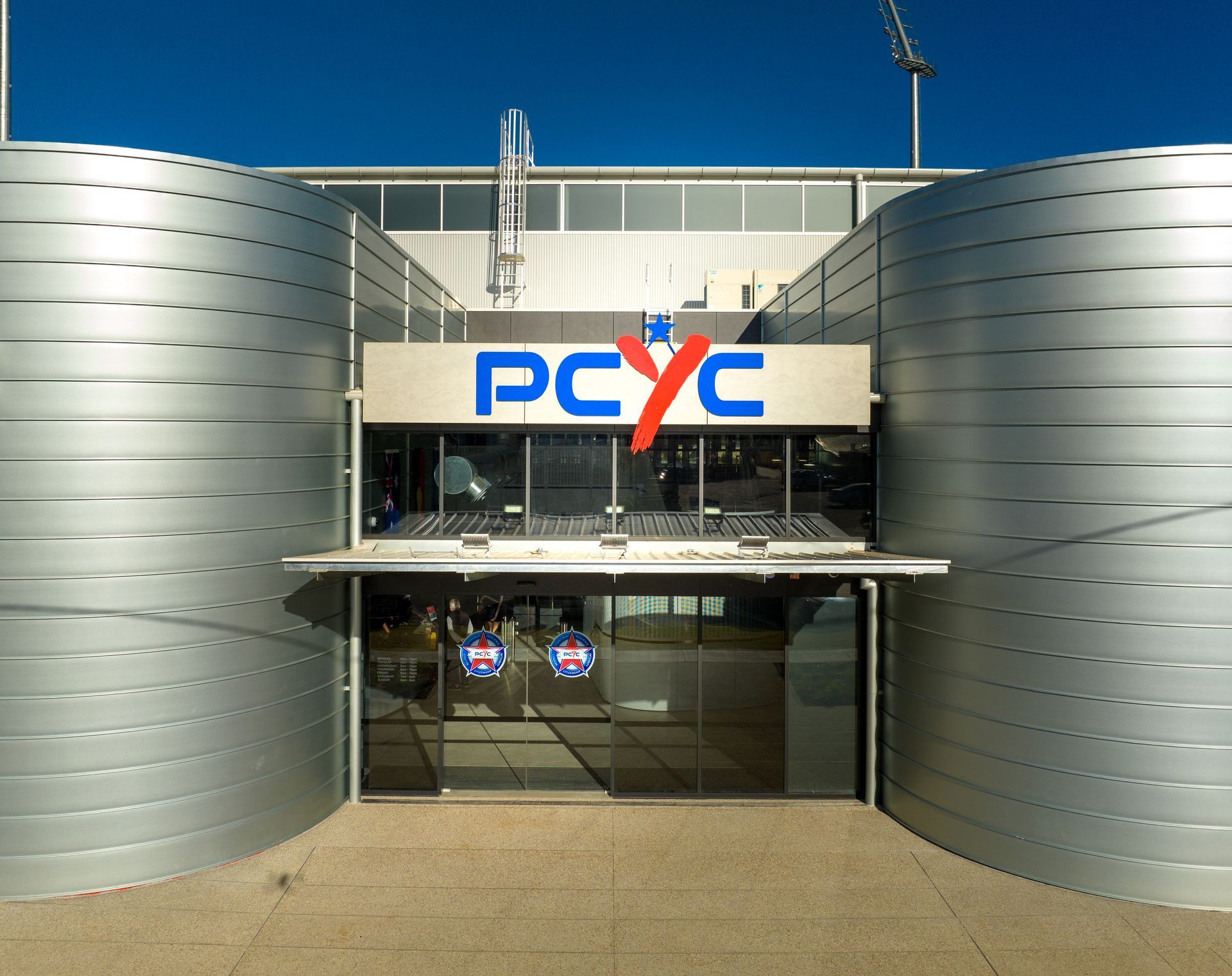 A building with a sign that says pcyc on it