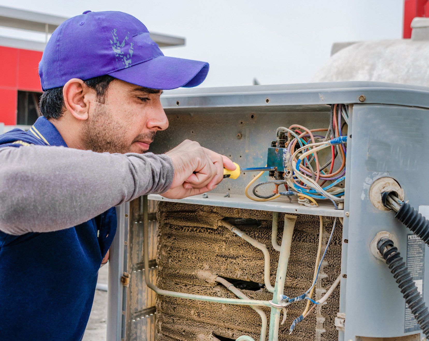 Electrician Man Is Fixing Air Conditioner | Murfreesboro, TN | Fann Mechanical Company