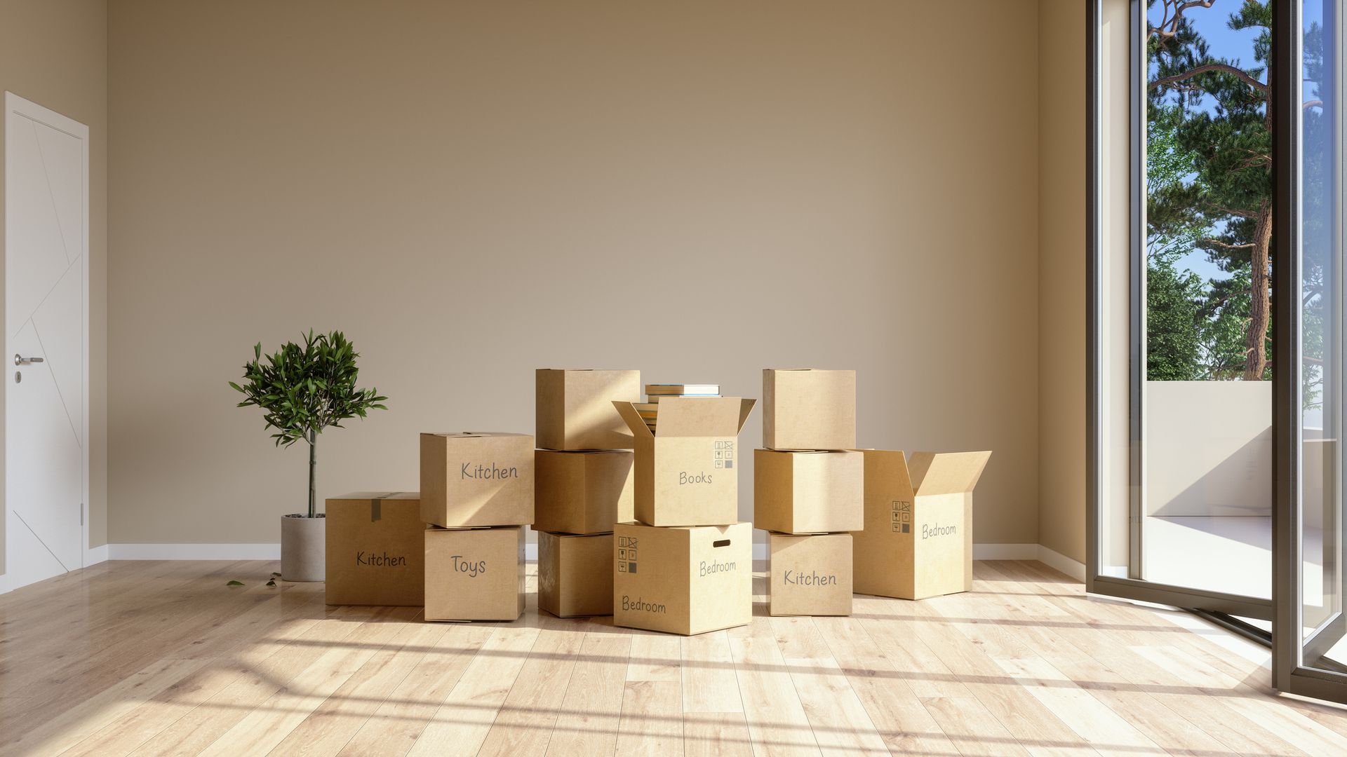 A bunch of cardboard boxes are stacked on top of each other in an empty room.