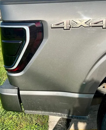 A close up of the back of a ford f150 truck.