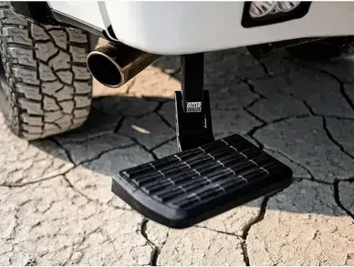 A close up of a step on the side of a truck.