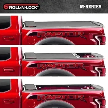 A red raptor truck with a roll n lock bed cover
