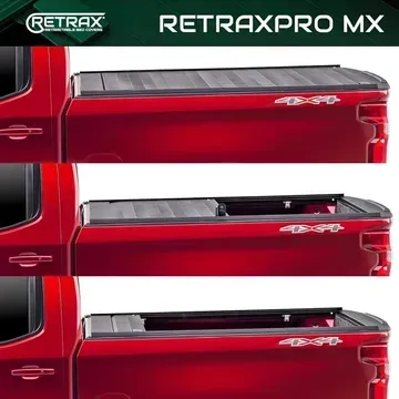 A red truck with a retraxpro mx bed cover on it.