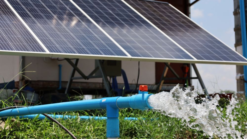 Solar Panels Powering a Water Pump, Spraying Water Into the Air — Milton Electrical Projects In Kaban, QLD