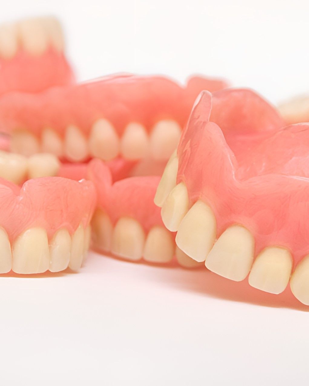 A Close Up of a Pair of Dentures on a White Surface — Yeppoon Denture Clinic in Gladstone, QLD