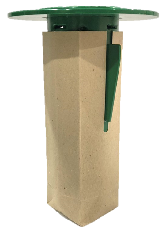 Green and tan ant trap: plastic top, paper bag body, attached green lever.